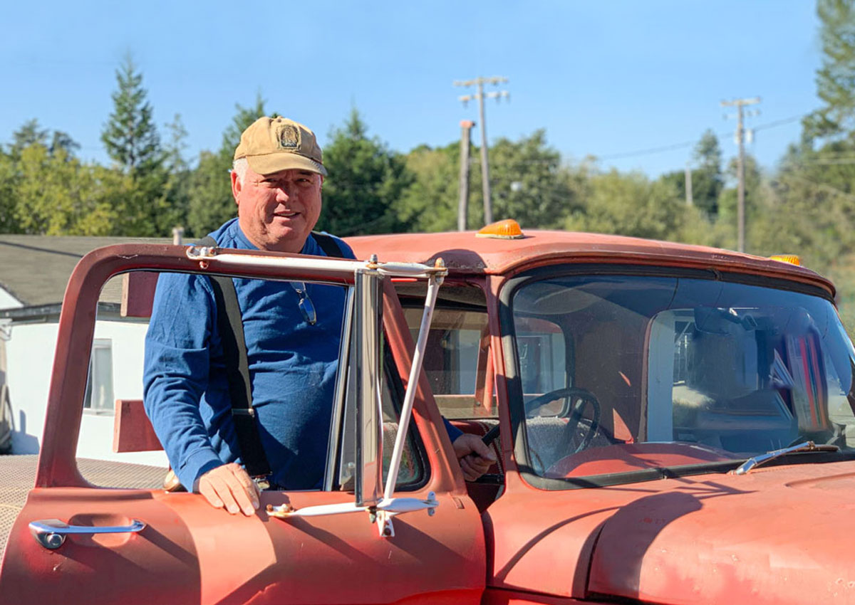 John Dierke in rustic red Ford truck